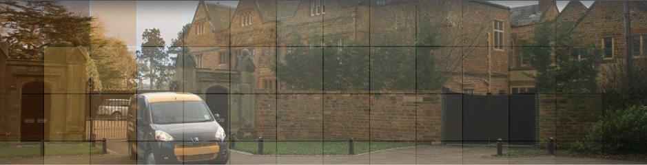 Small removal van leaving large estate home